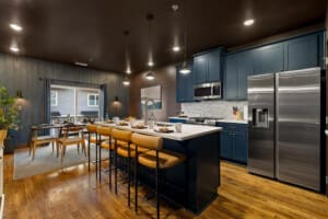 Family enjoying a spacious Chattanooga family vacation rental at Southside Speakeasy BNB with a large kitchen.
